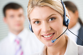 Face of young charming confident woman with headset